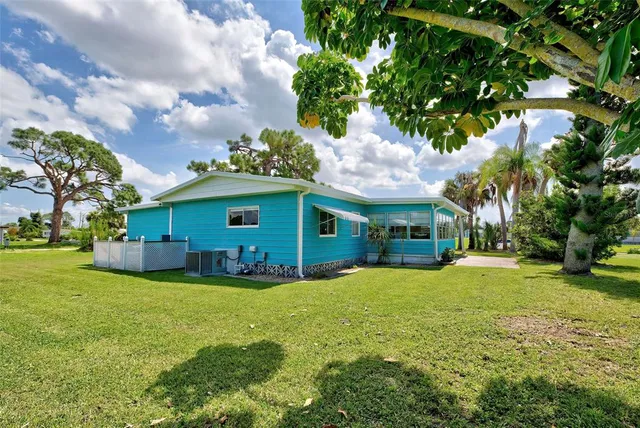 a living room with furniture a rug and gym equipment