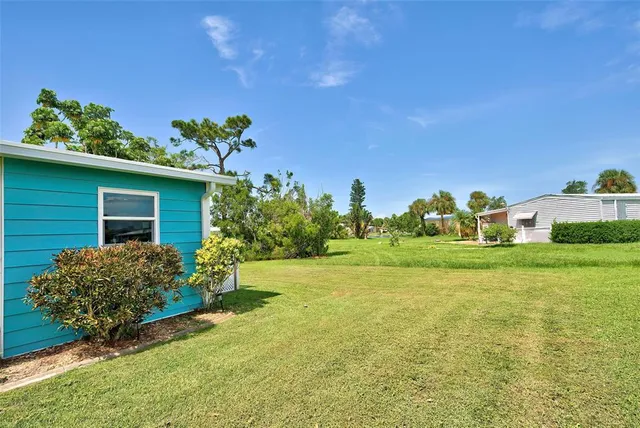 a living room with furniture a rug and a flat screen tv