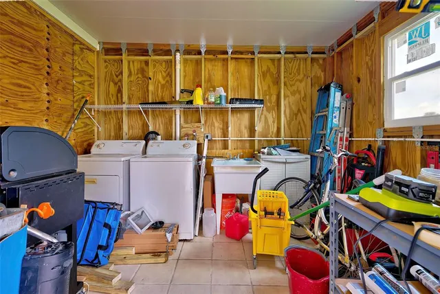 a living room with furniture a rug and a chandelier