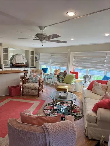 a kitchen with granite countertop a refrigerator a sink and dishwasher