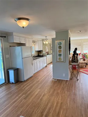 a kitchen with stainless steel appliances granite countertop a sink and cabinets