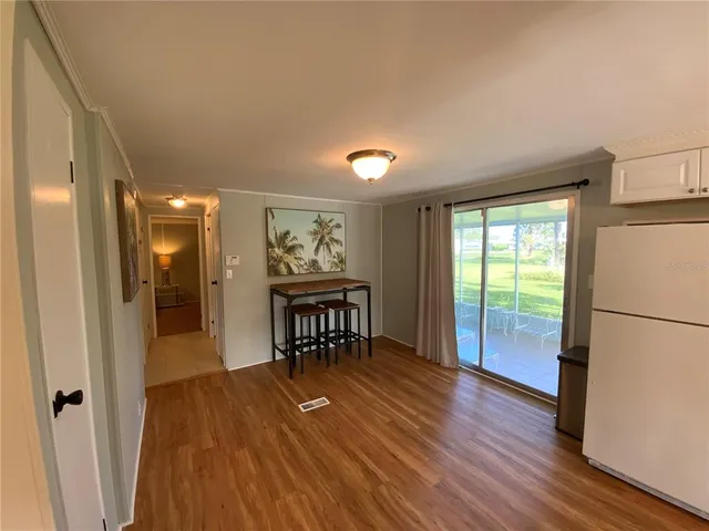 a bedroom with a bed and a mirror