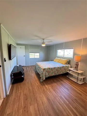 a bedroom with a bed and a view of bedroom