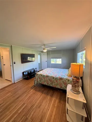 a bedroom with a bed and a dresser in it