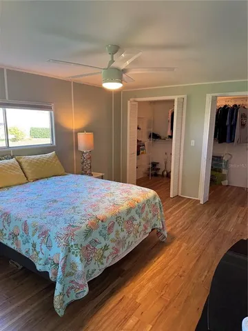 a bedroom with a bed and a walk in closet