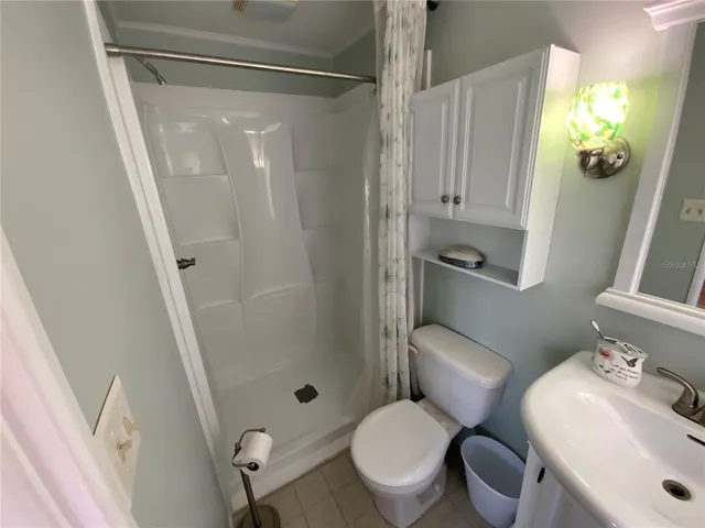 a living room with furniture and floor to ceiling window