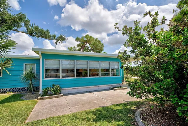 a view of a two chair under an umbrella