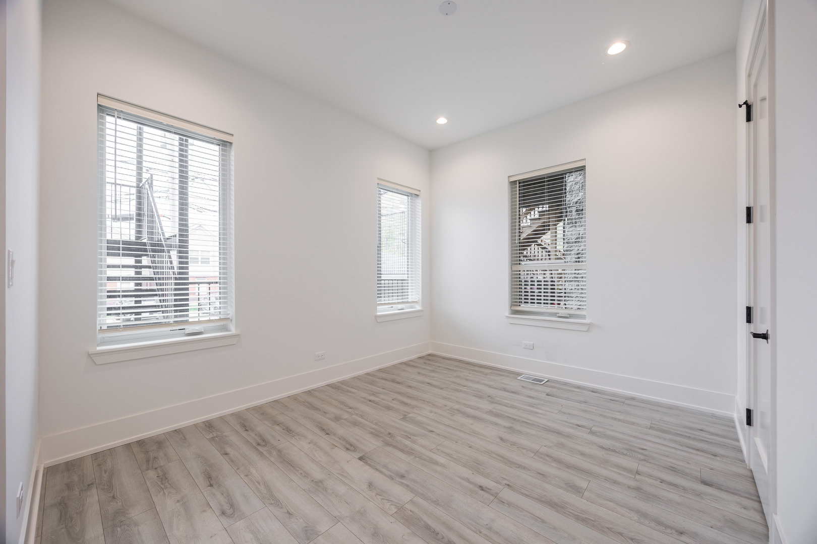 1814 West Thomas Street, Unit 1R Chicago, IL 60622 - Photo 13 of 26 a view of an empty room with wooden floor and a window