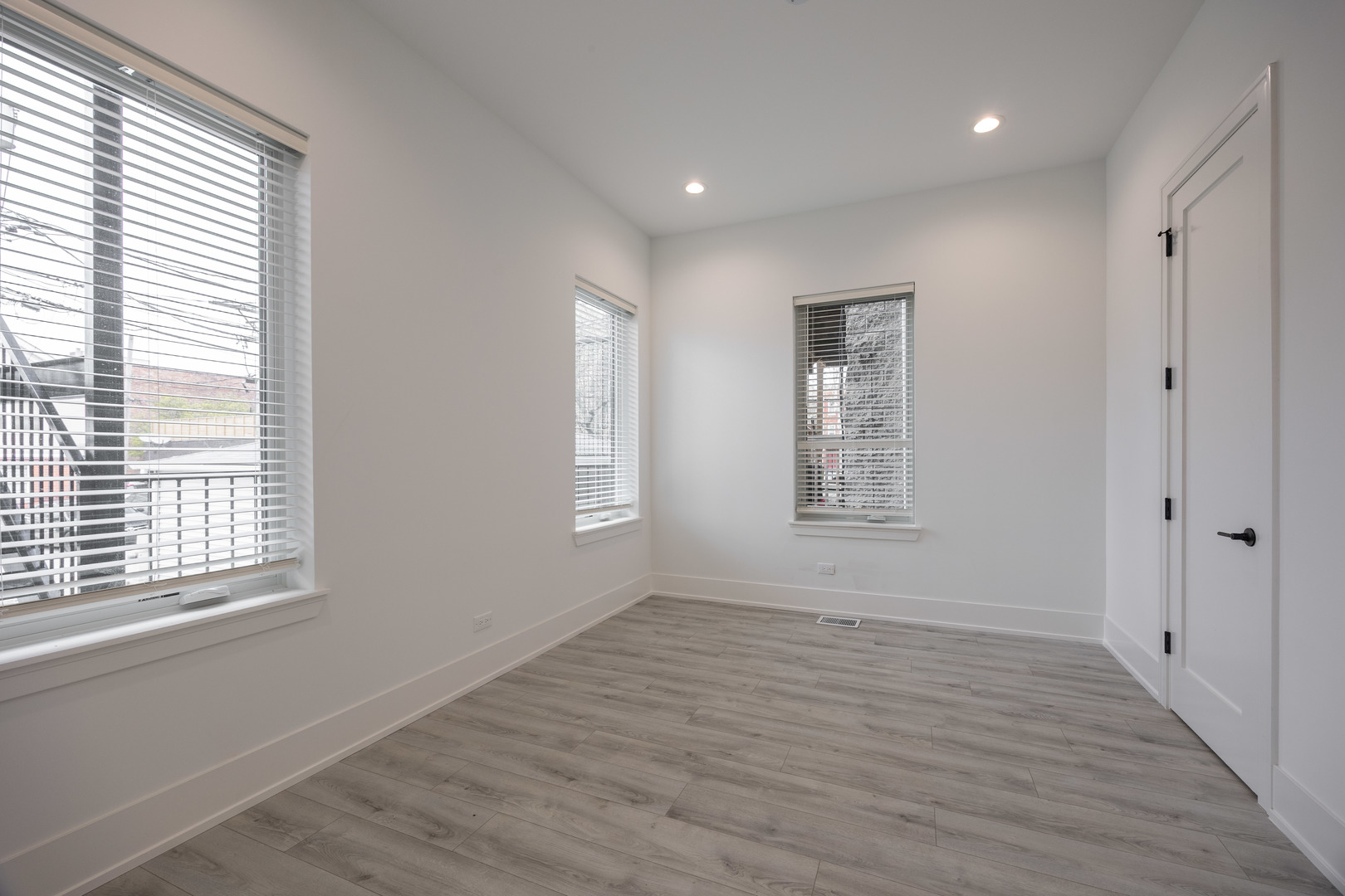 1814 West Thomas Street, Unit 1R Chicago, IL 60622 - Photo 14 of 26 a view of an empty room with wooden floor and a window