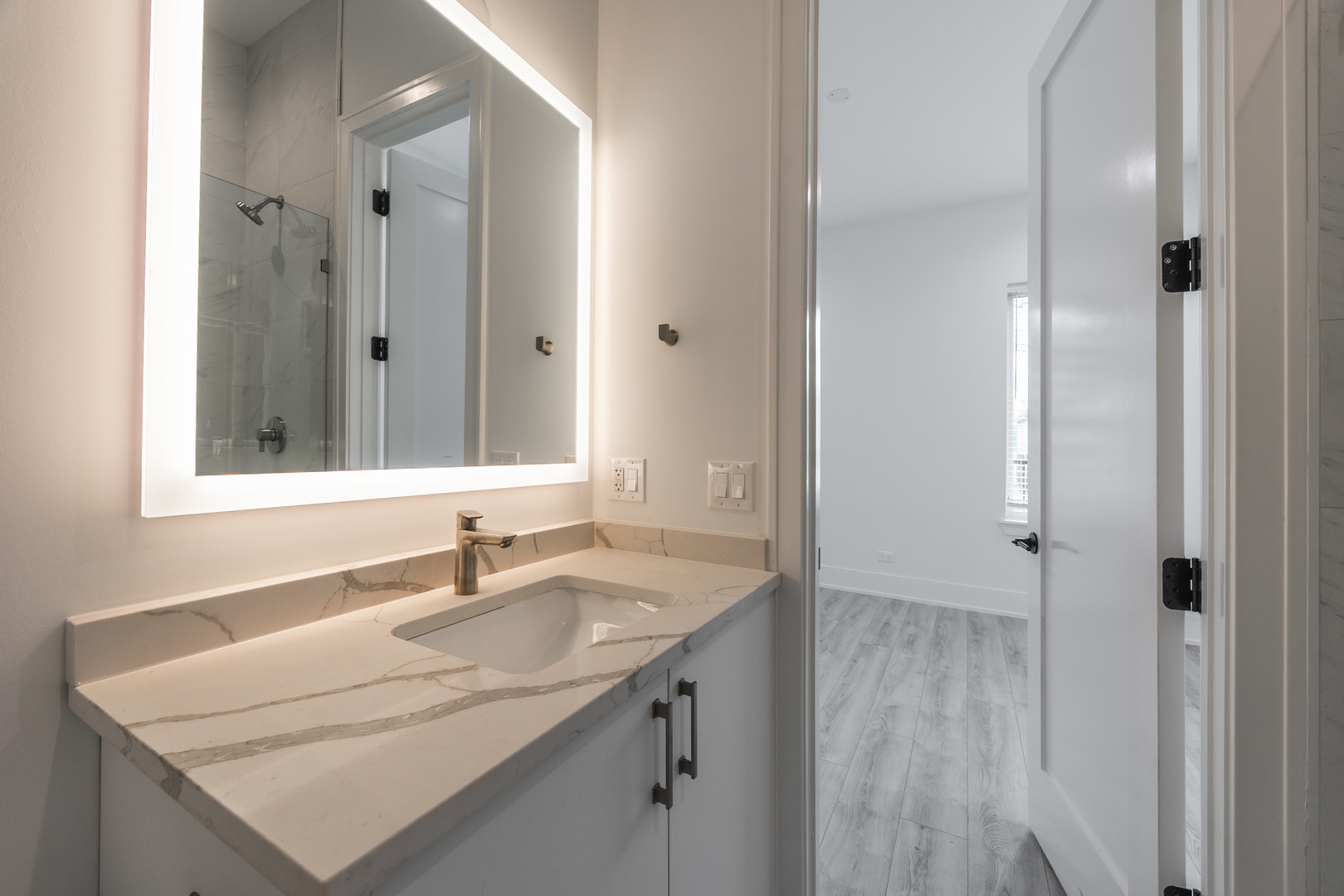 1814 West Thomas Street, Unit 1R Chicago, IL 60622 - Photo 18 of 26 a bathroom with a sink vanity granite and a mirror