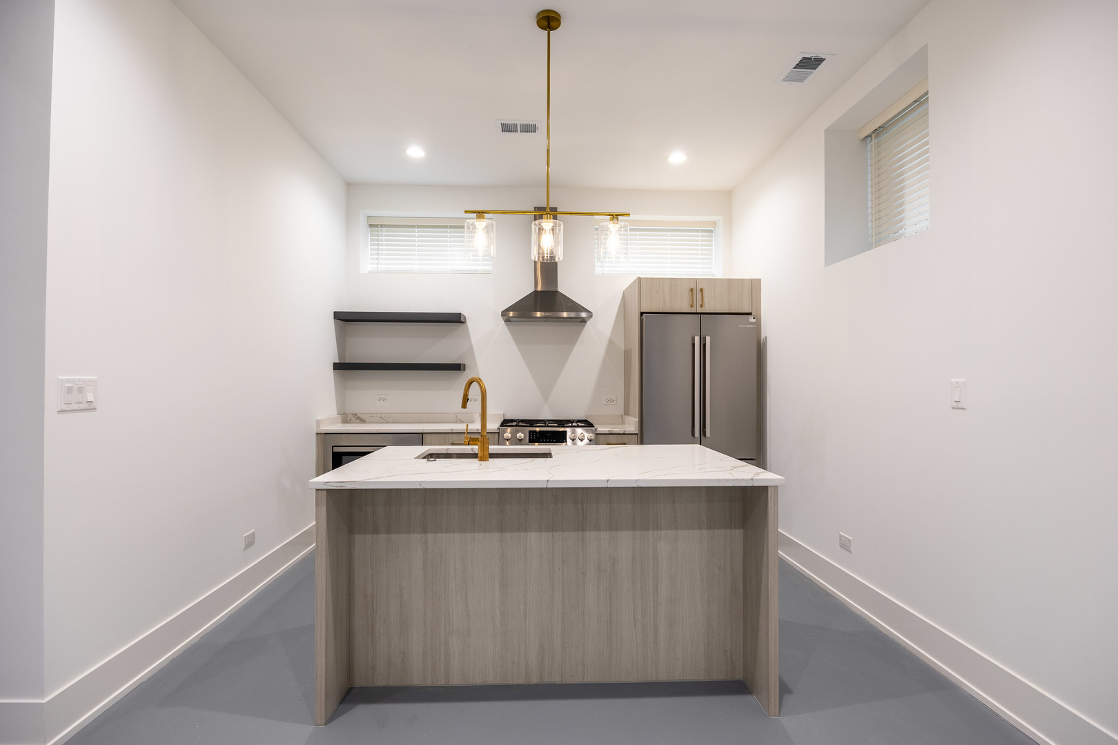 1814 West Thomas Street, Unit 1R Chicago, IL 60622 - Photo 2 of 26 a kitchen with kitchen island a stove a sink and a refrigerator