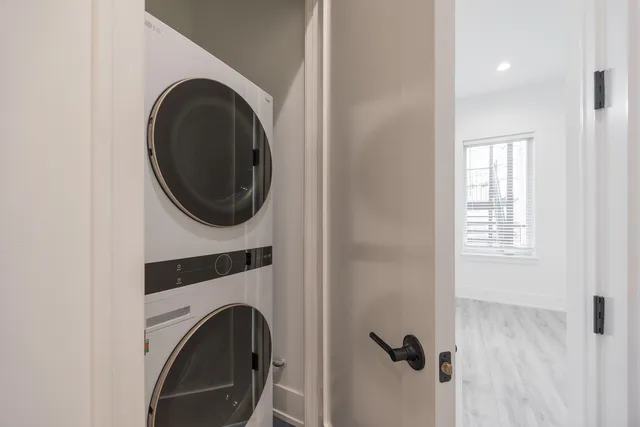 a view of livingroom with washer and dryer