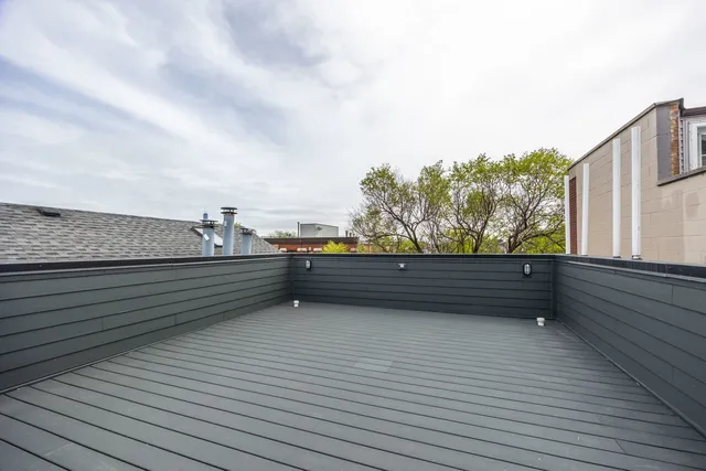 a view of outdoor space and wooden deck