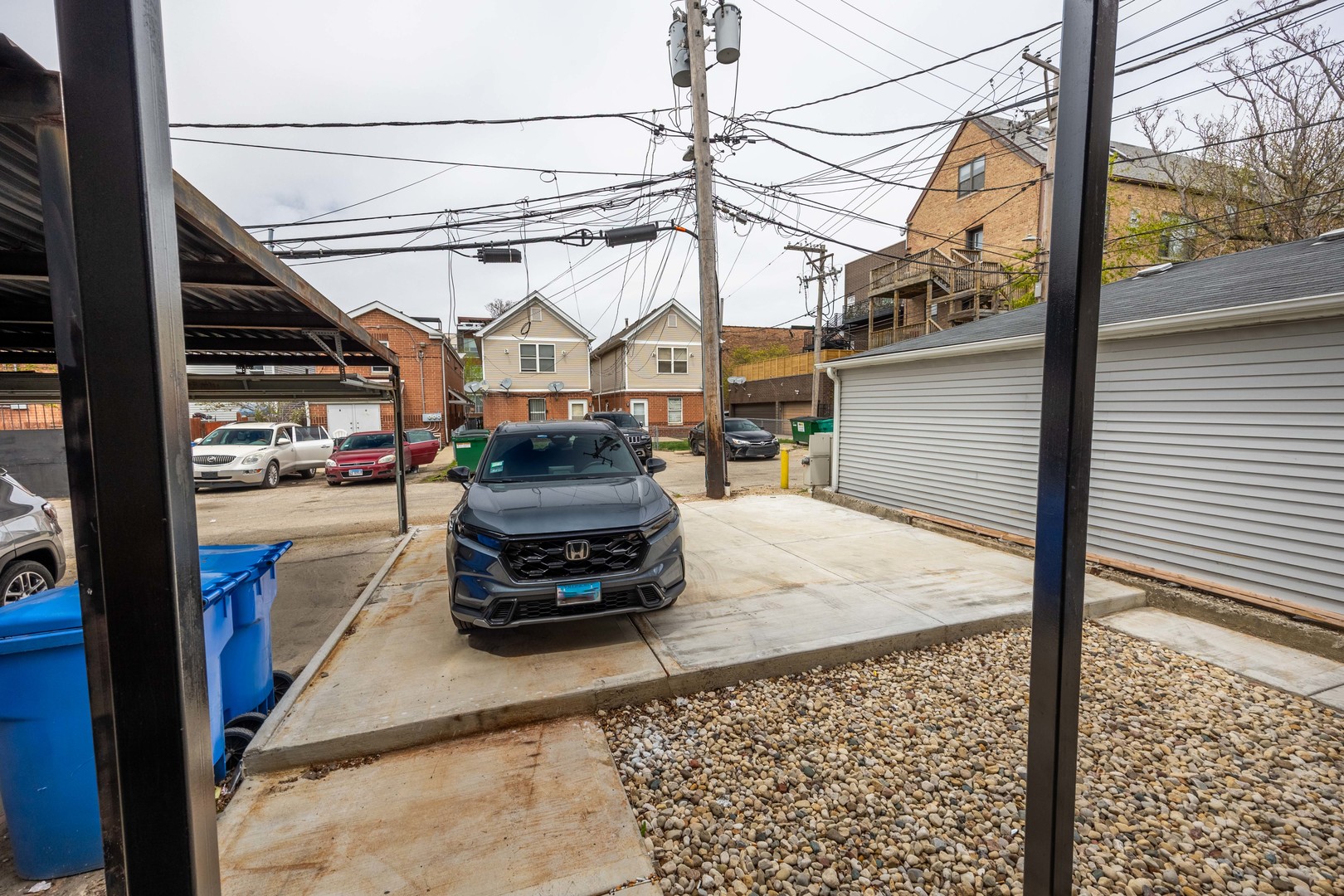 1814 West Thomas Street, Unit 1R Chicago, IL 60622 - Photo 24 of 26 a car parked on the side of the road