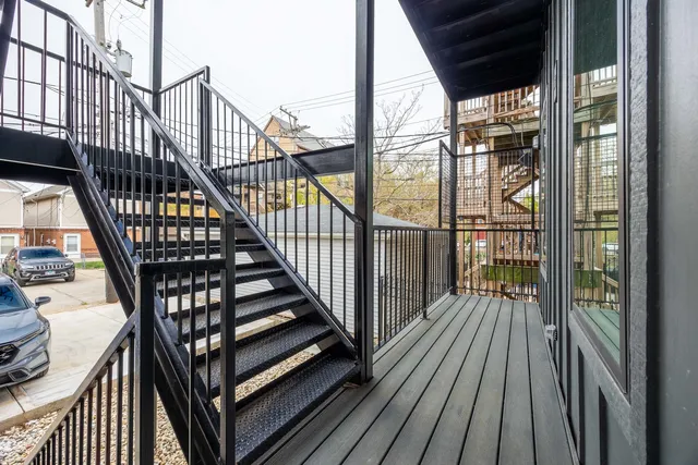 a view of balcony with wooden floor