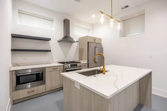 a kitchen that has a stove and a table