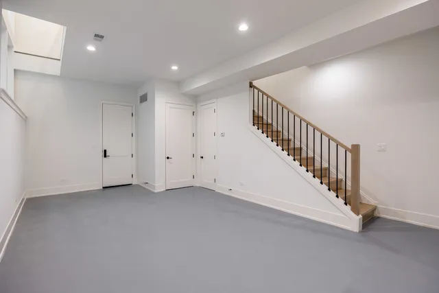 a view of an empty room with stairs