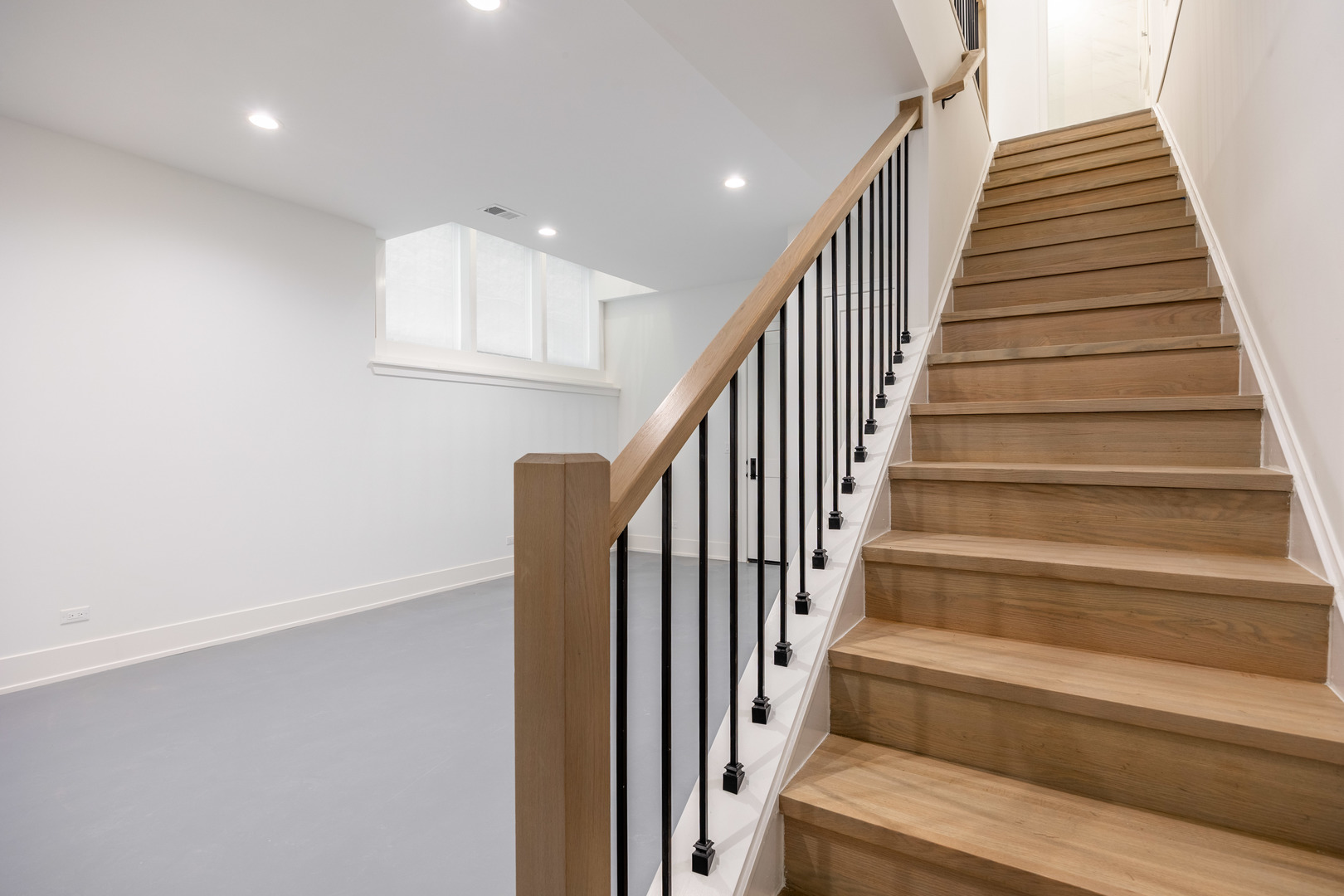 1814 West Thomas Street, Unit 1R Chicago, IL 60622 - Photo 9 of 26 a view of staircase with wooden floor and white walls