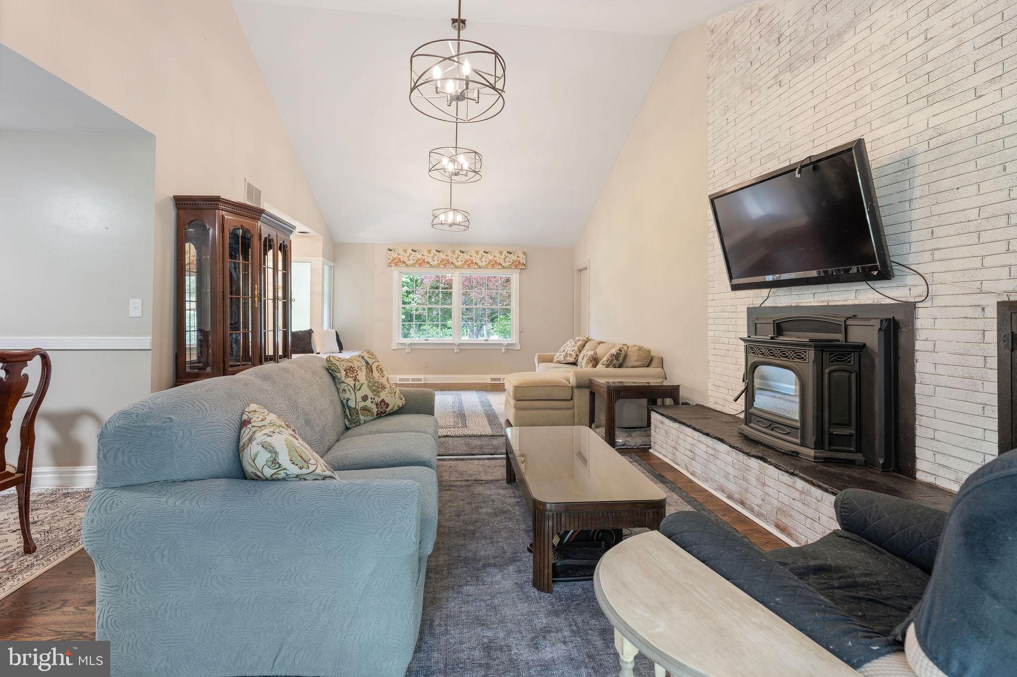 6605 Mt Vista Road Kingsville, MD 21087 - Photo 51 of 54 a living room with furniture a flat screen tv and a fireplace