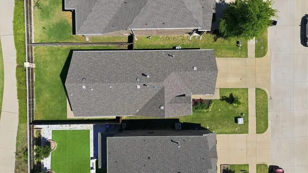 an aerial view of residential houses with outdoor space