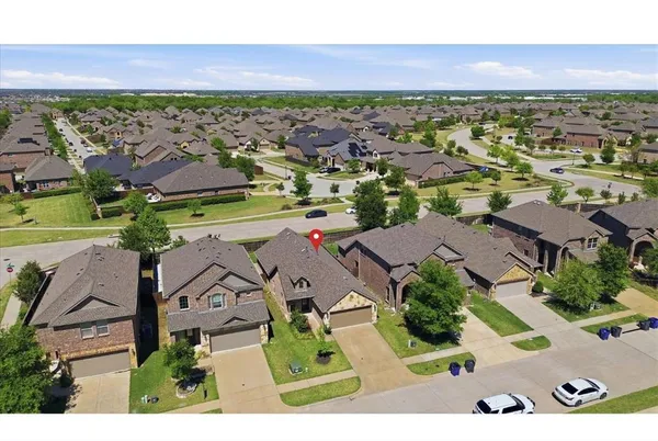 an aerial view of residential houses with outdoor space
