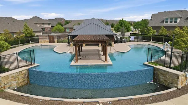 a view of a house with pool porch and sitting area