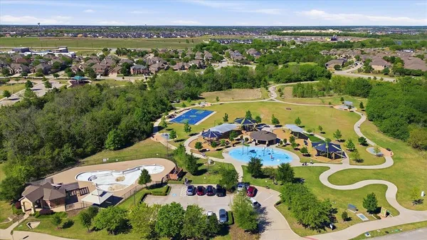 an aerial view of a house with outdoor space
