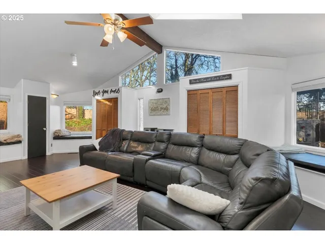 a living room with furniture and a window