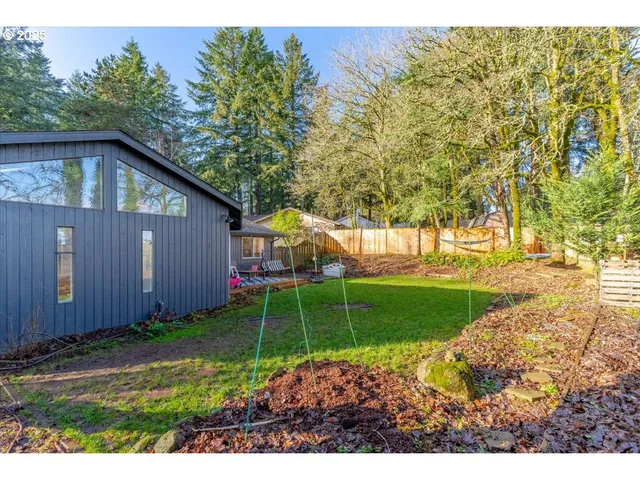 a backyard of a house with lots of green space