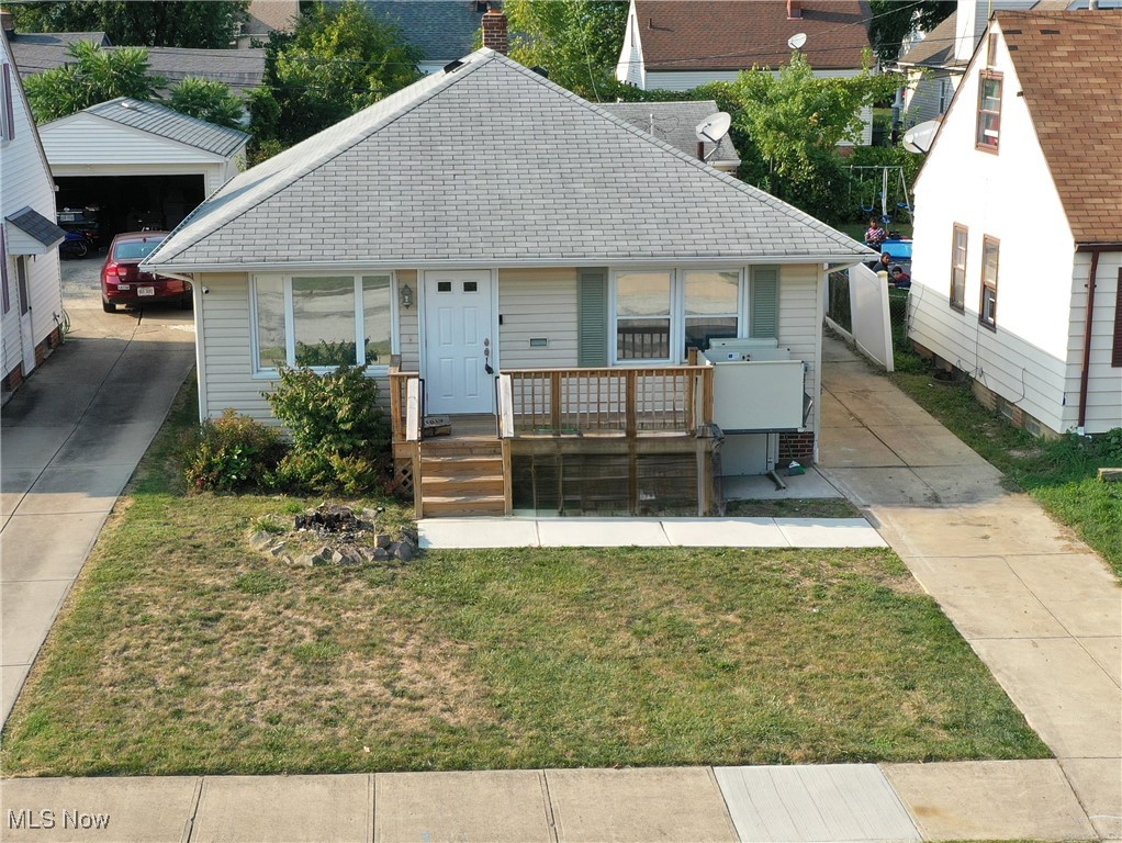 11913 Derby Road Cleveland, OH 44125 - Photo 2 of 28 View of front of property with a front lawn and covered porch