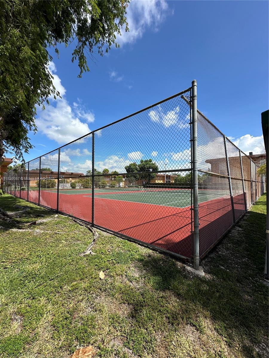 9487 Southwest 76th Street, Unit M8 Miami, FL 33173 - Photo 16 of 16 a view of a backyard