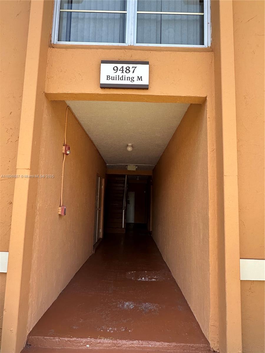9487 Southwest 76th Street, Unit M8 Miami, FL 33173 - Photo 2 of 16 a view of a street sign