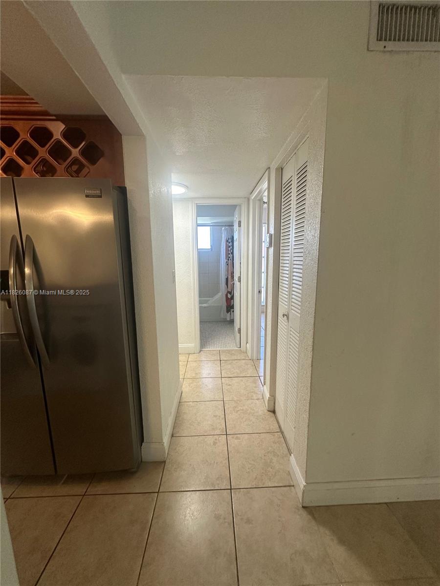 9487 Southwest 76th Street, Unit M8 Miami, FL 33173 - Photo 8 of 16 a view of entryway