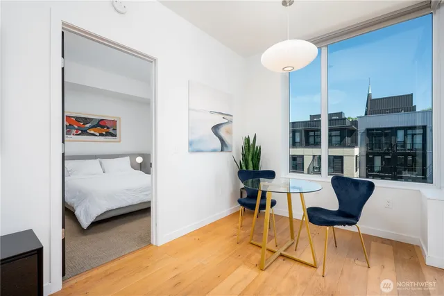 a bedroom with furniture and a potted plant