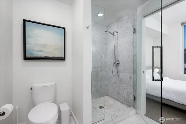 a bathroom with a toilet sink and shower