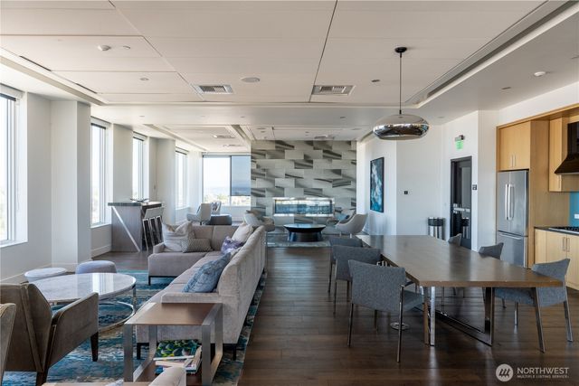 a living room with lots of furniture and a chandelier