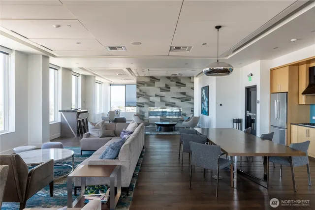 a living room with lots of furniture and a chandelier