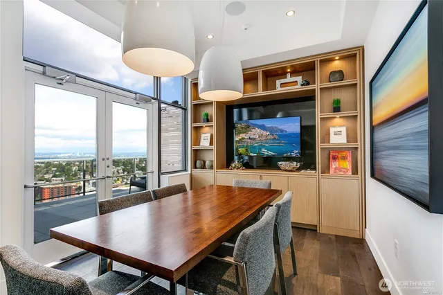 a view of a dining room with furniture window and wooden floor