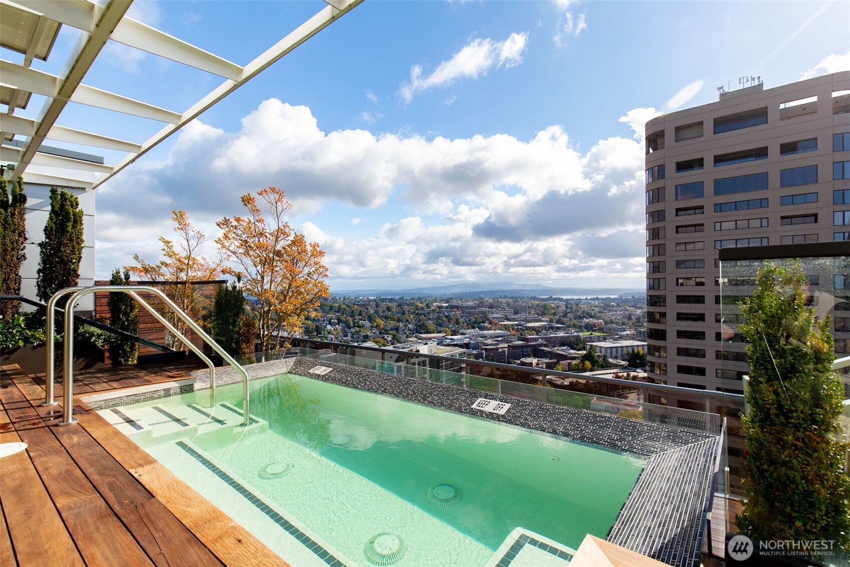 1321 Seneca Street, Unit 703 Seattle, WA 98101 - Photo 40 of 40 a view of a balcony with floor to ceiling windows and wooden floor