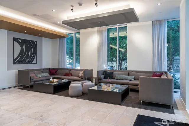 a living room with furniture and a large window