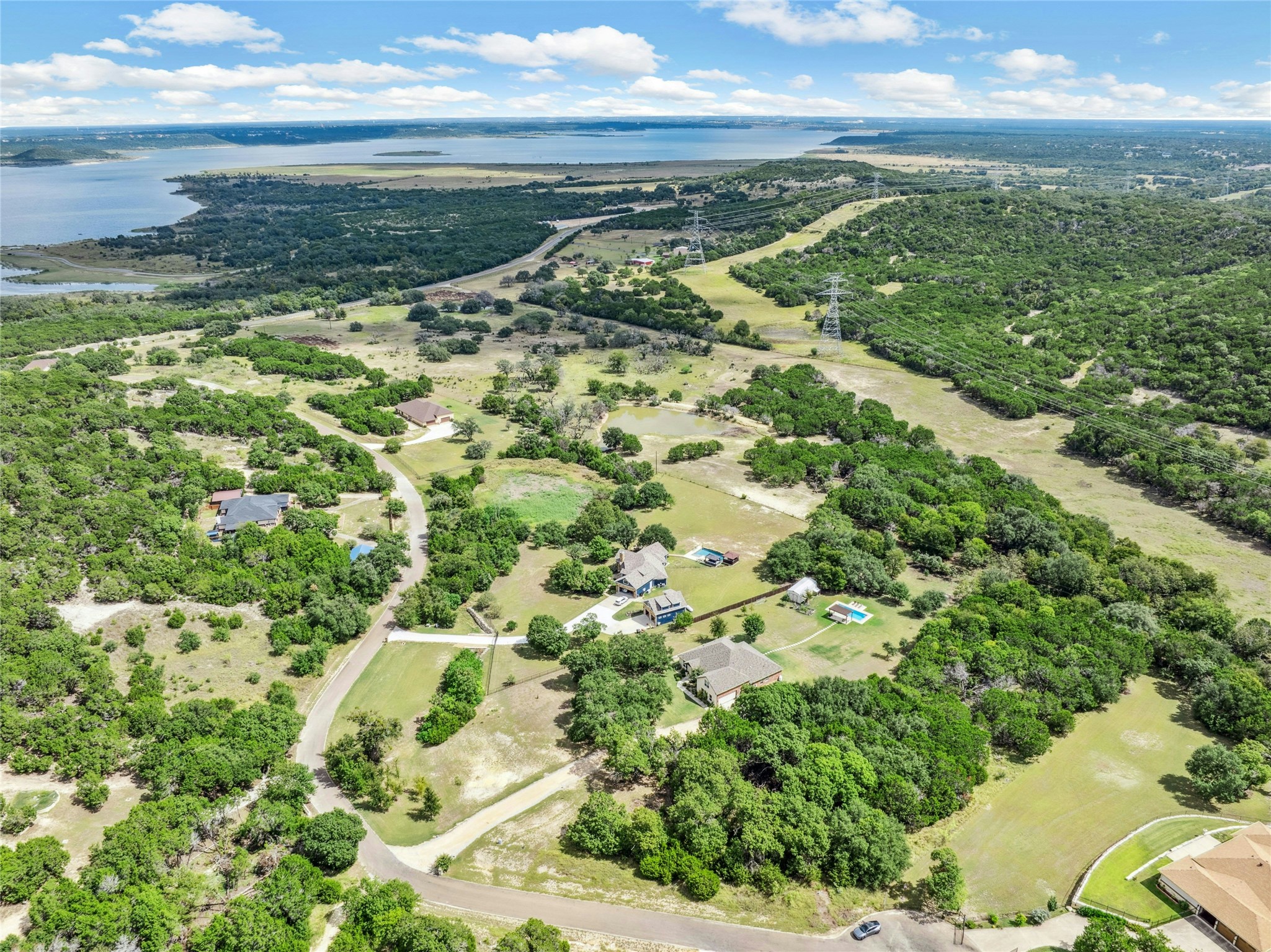 1386 Windy Hill Road Salado, TX 76571 - Photo 1 of 6 a view of a lake with a yard