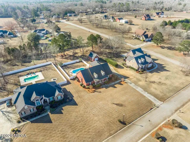 an aerial view of a house with outdoor space
