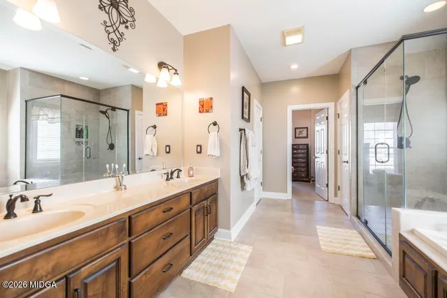 a bathroom with a bathtub and a shower