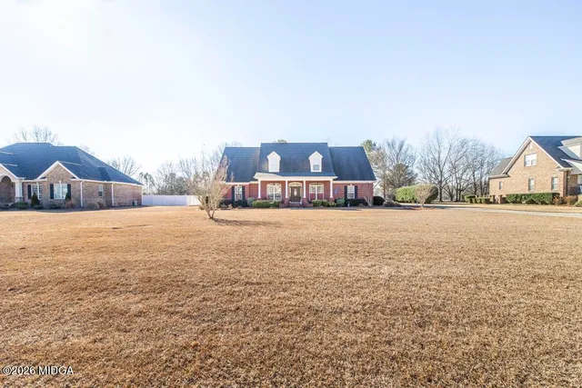 a view of houses with yard