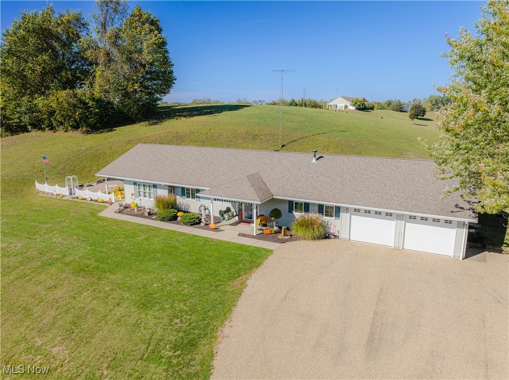 90480 Kilgore Ridge Road Scio, OH 43988 - Photo 33 of 39 Ranch-style house featuring asphalt driveway, a front yard, and an attached garage