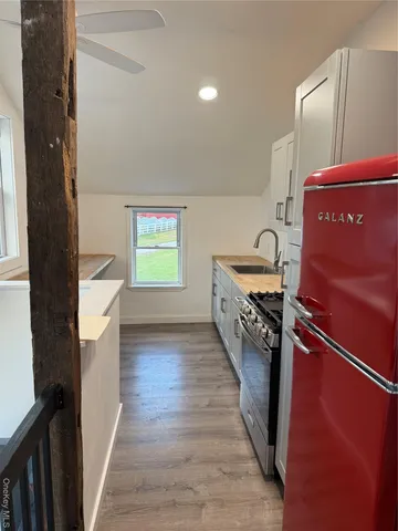 a hallway with a washer and dryer