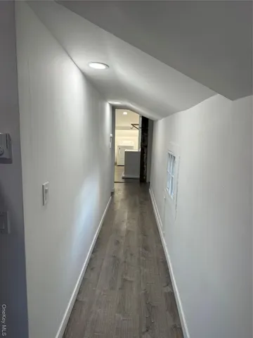 a view of a hallway with a white walls