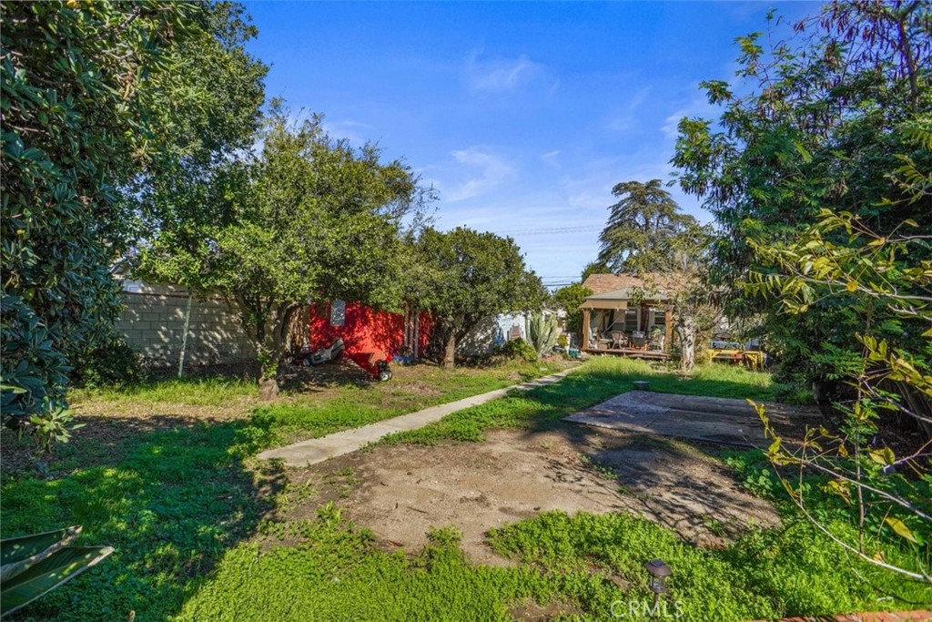 10007 Haddon Avenue Pacoima, CA 91331 - Photo 15 of 22 a front view of a house with a yard and garage