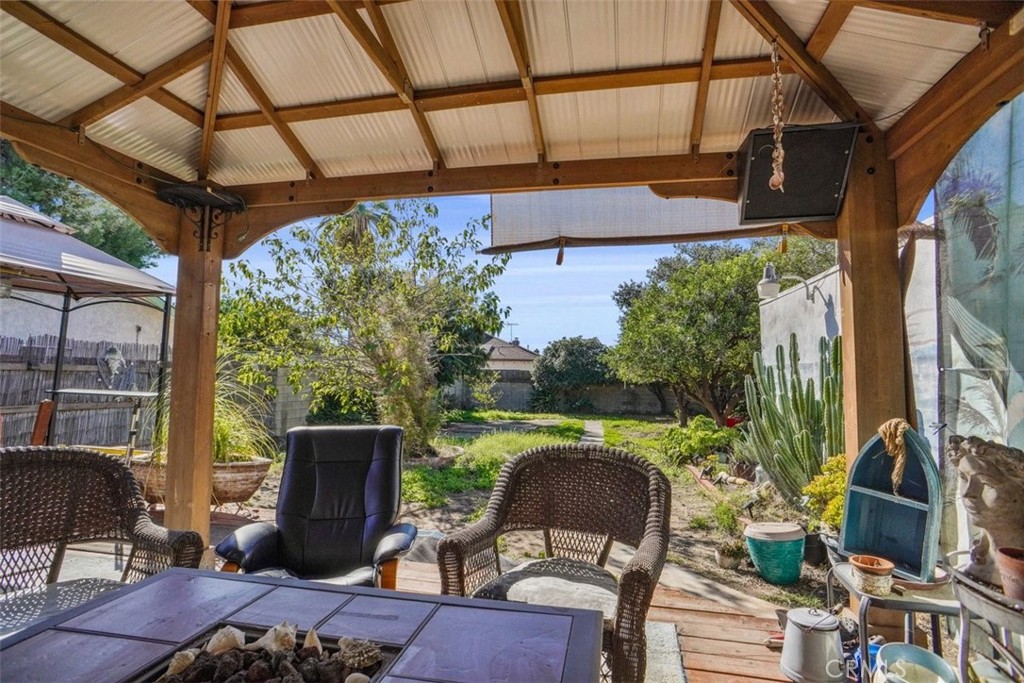 10007 Haddon Avenue Pacoima, CA 91331 - Photo 17 of 22 a patio table with chairs and a potted plant
