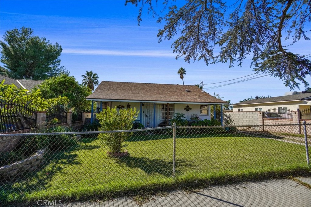 10007 Haddon Avenue Pacoima, CA 91331 - Photo 2 of 22 a front view of a house with garden